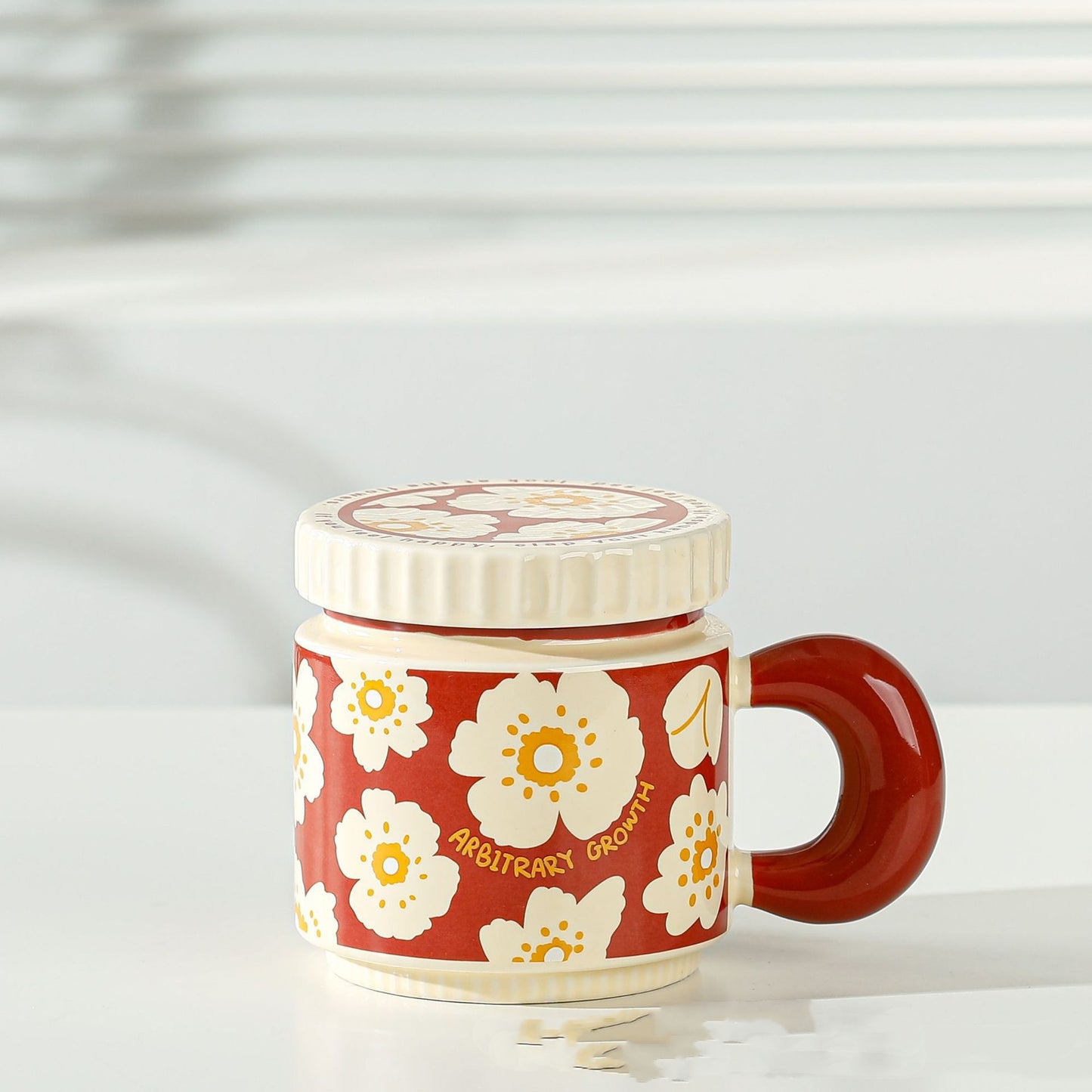 Colorful niche-style ceramic mugs on table