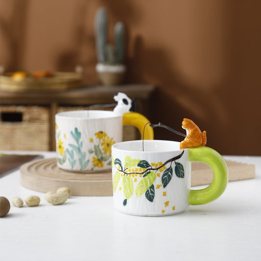 Handmade ceramic cat handle mug with leaf print